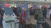 Holiday travelers lining up at Logan Airport trying to get out before the storm