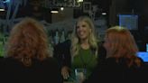 Local 5’s Kaitlin Corbett helps serve drinks at Black Saddle during fundraising event
