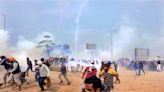 Police use tear gas against Indian farmers marching to New Delhi to demand guaranteed crop prices