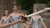 Despite weather glitch, the Paris Olympics flame is lit at the Greek cradle of ancient games