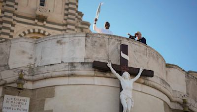 Torchbearers in Marseille kick off the Olympic flame's journey across France