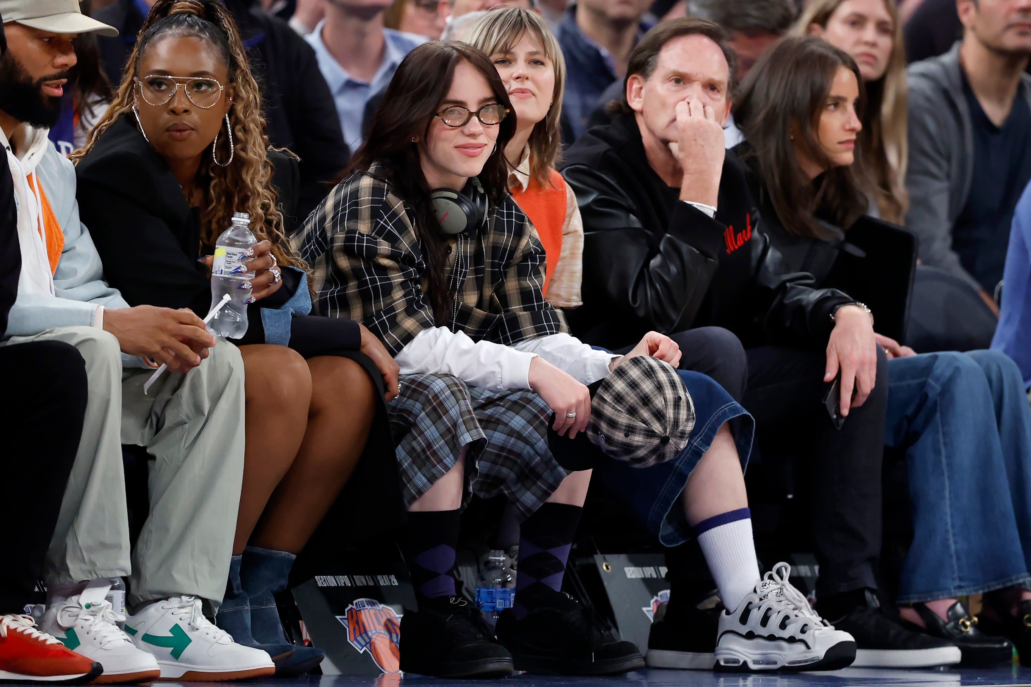 Billie Eilish Paired Four Different Plaid Pieces at a Basketball Game — See Photos