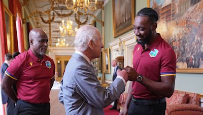 King Charles learns new handshake and fist bumps West Indies cricket players | ITV News