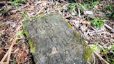 Mysterious old gravestone found along Cuyahoga River