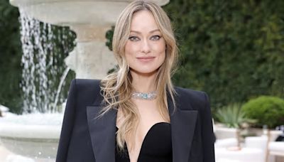 Olivia Wilde dazzles in a plunging black dress as she attends Tiffany & Co's star-studded event in Beverly Hills