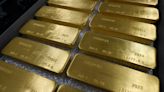 Gold rebounds from 1-month lows as dollar cools