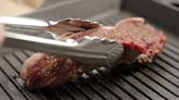 Why You Should Only Use Tongs To Flip Your Steaks