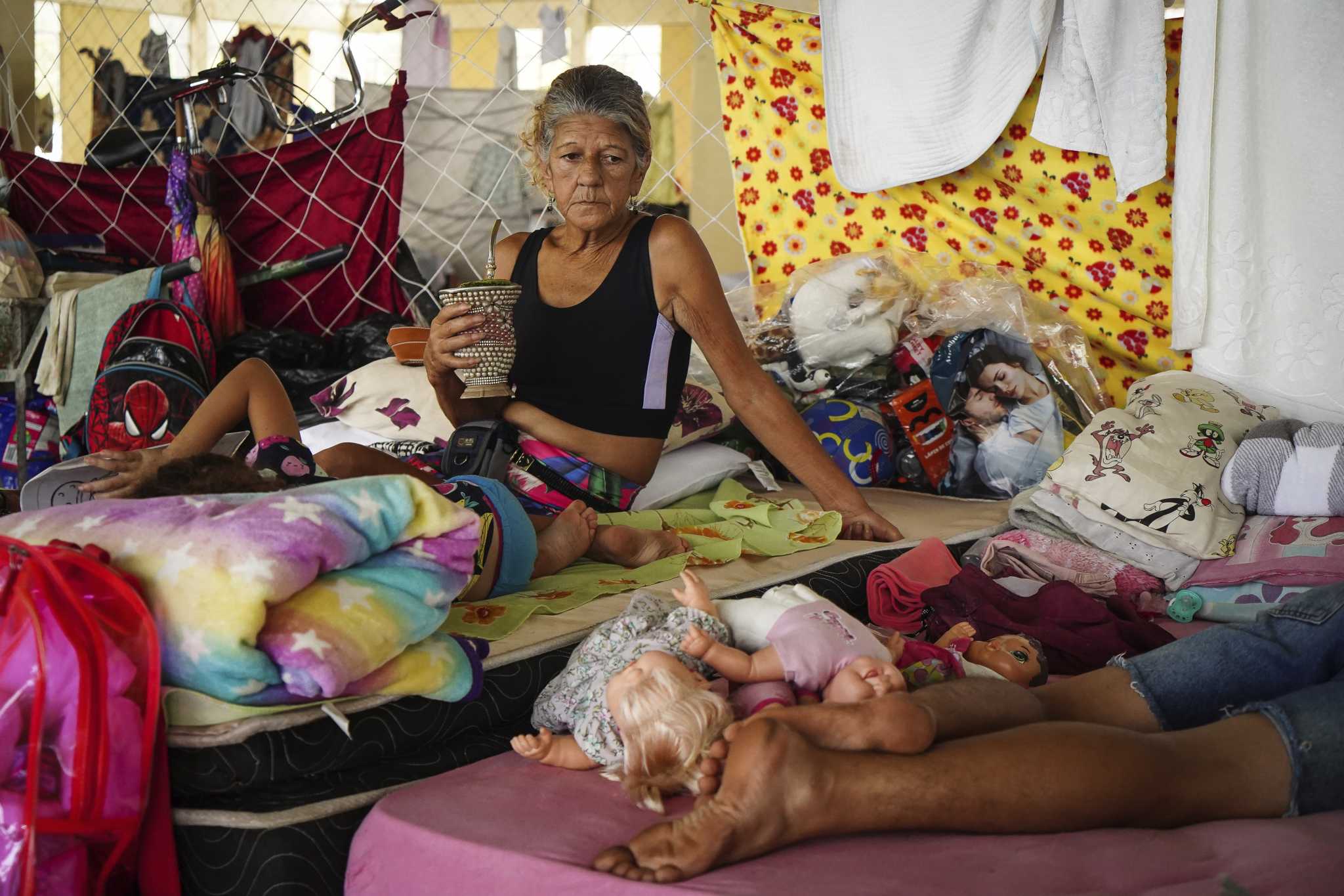 Flooding forecast to worsen in Brazil's south, where many who remain are poor