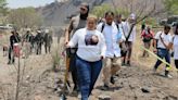 Searchers find a charred pit on Mexico City's outskirts that may be a clandestine crematorium