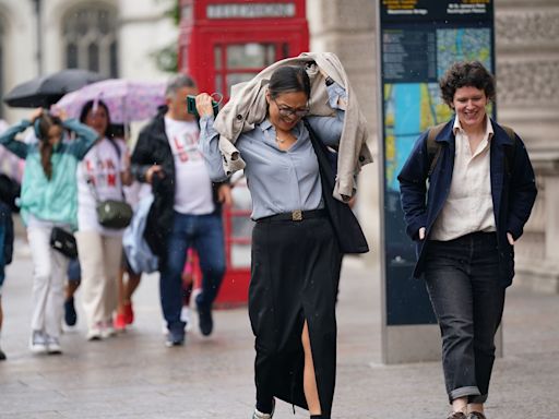 Heavy downpours batter the UK as temperatures soar to 30C