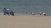 Beach day in April? People warned not to go in water due to cold temperatures, no lifeguards