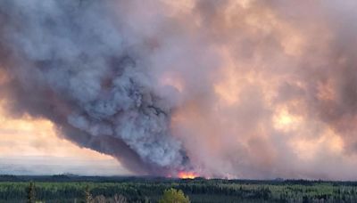 Unwieldy wildfires scorch Canada and threaten a community scarred by past catastrophe