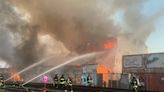 Four-alarm fire burns lumber yard in Oakland