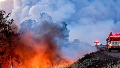 Man arrested over California fire sparked by burning car pushed into gully