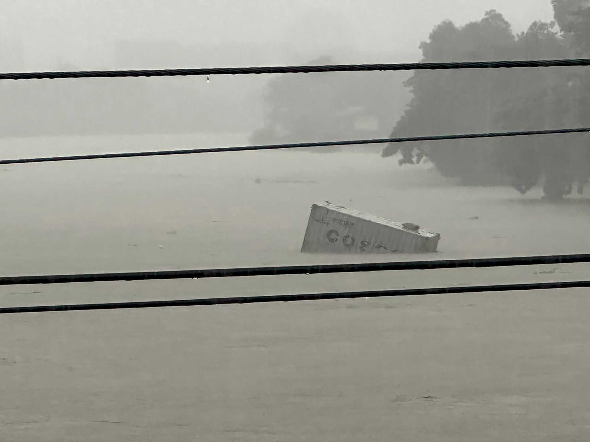 Taiwan prepares for a strong typhoon that worsened monsoon rains in the Philippines, killing 13