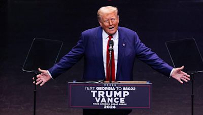 Donald Trump Trolled Over His 'Small Head' as He Tosses Chicken Nuggets Into a Crowd at Alabama Game — Watch