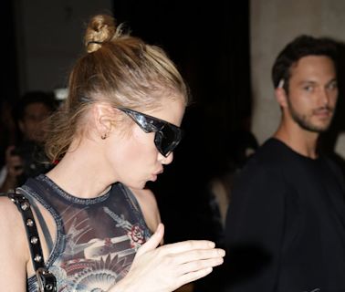 Stella Maxwell leaves her hotel with a mystery man during PFW