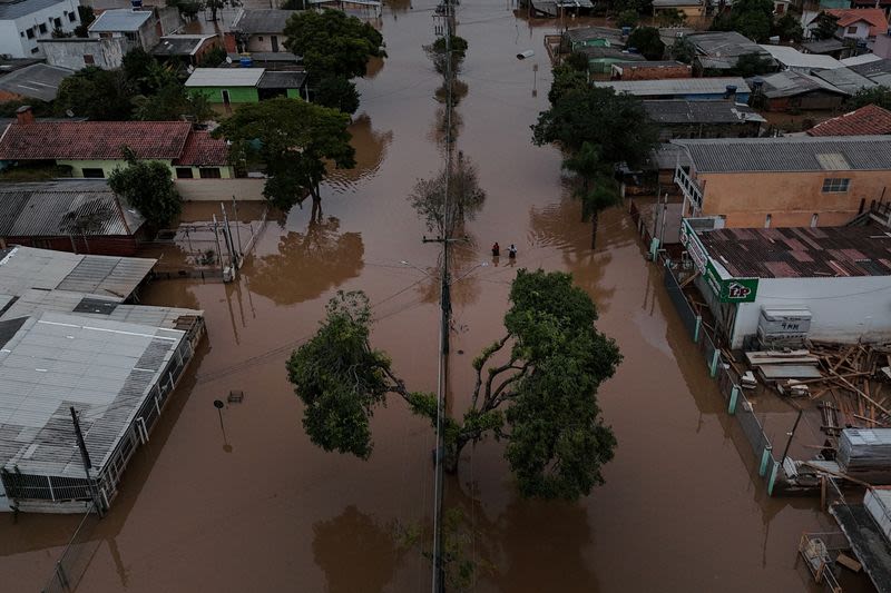 Flood-battered farmers in southern Brazil wade through lost harvests
