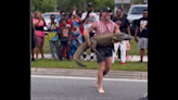 Barefoot man recorded jumping on alligator in Florida highway. ‘Hold my sweet tea’