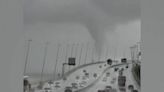 Large waterspout looms over Lisbon bridge in impressive eyewitness footage