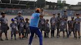 Baseball becomes a shelter for Venezuelan children in soccer-mad Peru