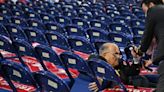 Rudy Giuliani takes a fall and tumbles into chairs while walking RNC floor