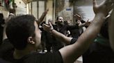 Shiite Muslims in Mideast mark the solemn holy day of Ashoura