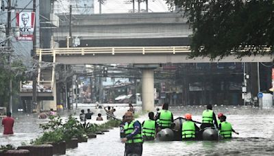 Stranded commuters, motorists endure Metro Manila's floods