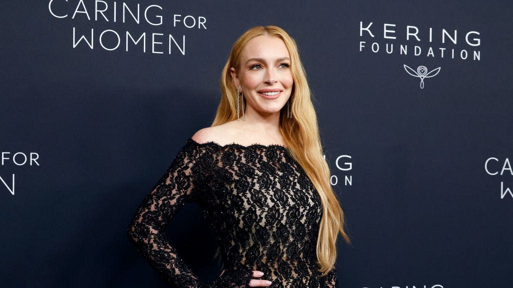 Lindsay Lohan Wows in a Floral Lace Catsuit Studded With Crystals