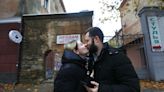 'I'm not going without you.' Ukrainian lovers defy the rules of war