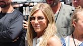 Jennifer Aniston makes heads turn in a low-cut blouse and linen pants