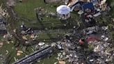 Wreckage is strewn across a property the day after a deadly series of tornados in Texas