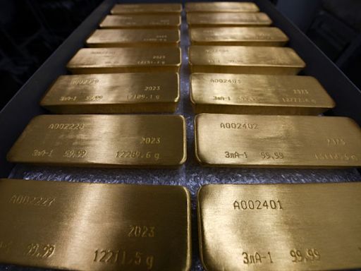 Gold dips on higher bond yields, Fed speakers on tap