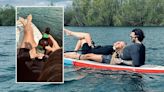 Laura Woods cosies up to Love Island star boyfriend Adam Collard on paddleboard