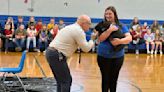 Principal kisses pig after students read 7,700 books