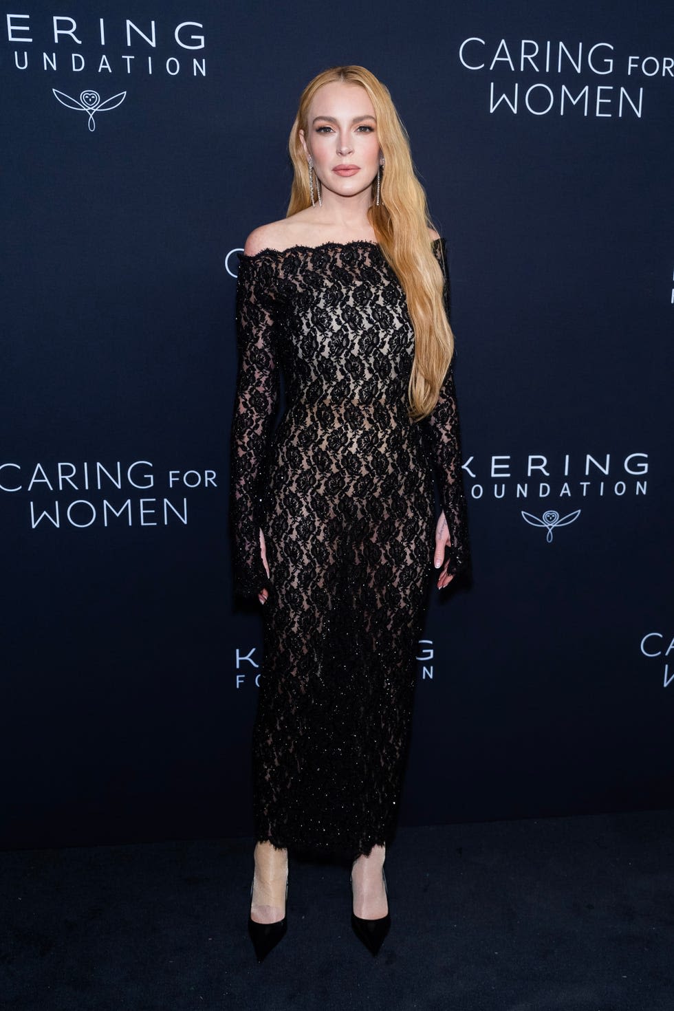 Lindsay Lohan Wows in a Floral Lace Catsuit Studded With Crystals