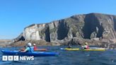 Kayaking to clear plastic off Devon’s beaches