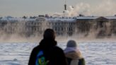 Freezing Russians forced to cook their meals in the street