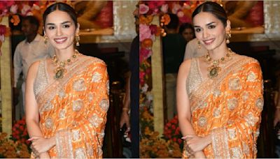 Manushi Chhillar embraces her traditional side in a stunning orange and gold bandhani saree at the pre-wedding celebrations of Anant Ambani and Radhika Merchant.