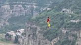 Chinese slackliner crosses gorge on tightrope at altitude of 186 meters