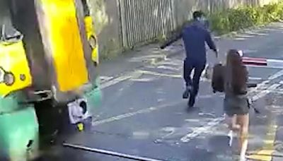 Shocking footage shows people risking lives at train crossings