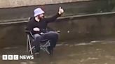Man goes fishing in flooded Peterhead street following heavy rain