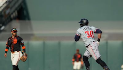Twins top Giants as Santana delivers tiebreaking home run that's just fair