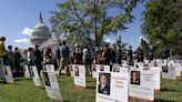 Posters of Officers Caught in Senator's Promotions Hold Dot Capitol Lawn in Vet Group's Protest