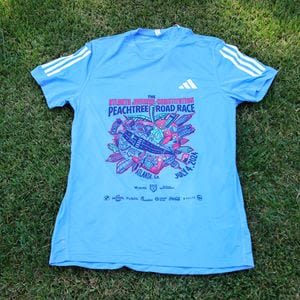 The votes are in for the 2024 Peachtree Road Race T-shirt. Which shirt won?