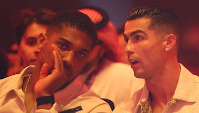 Watch: Cristiano Ronaldo spared another Conor McGregor meeting as he sits with Anthony Joshua