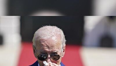 Biden faces intensified calls to step aside after diagnosed with Covid-19