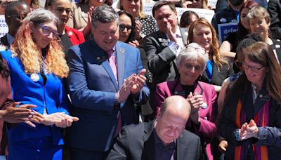 Repeal of state Constitution’s same-sex marriage ban heads to voters with Gov. Polis’ signature