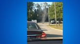 Drivers seen passing through landspout at intersection