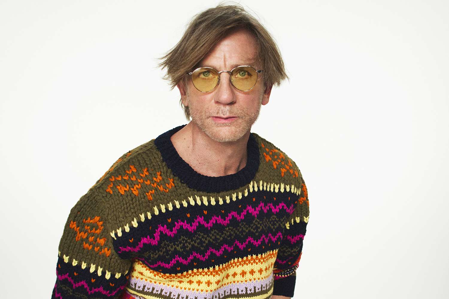 Daniel Craig Is Almost Unrecognizable with Side Bangs and Grandpa Sweater in Loewe’s New Campaign